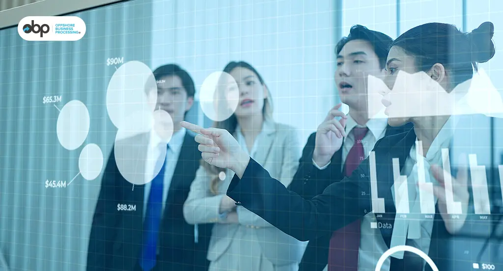 Business team reviewing performance data on a digital display