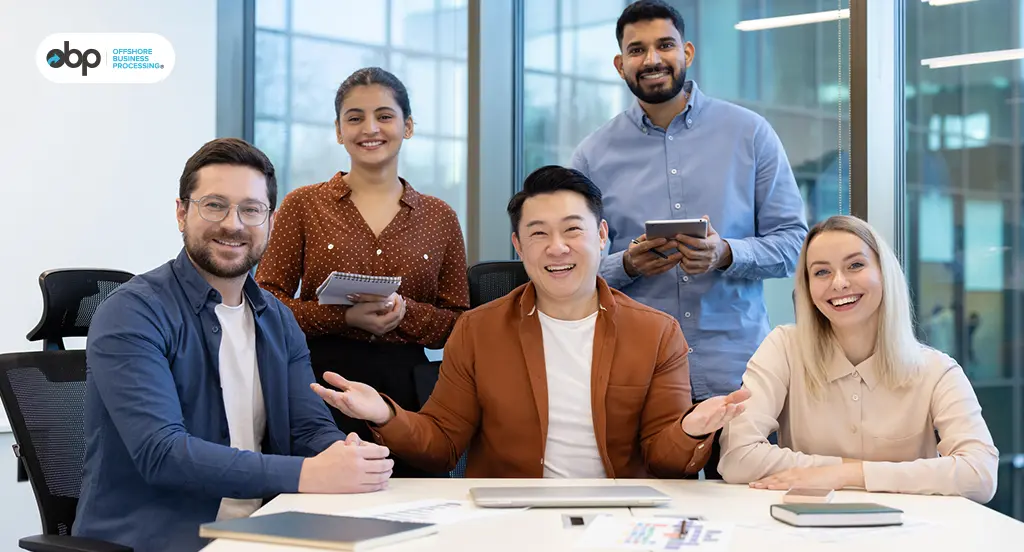 Diverse offshore team collaborating in a modern office