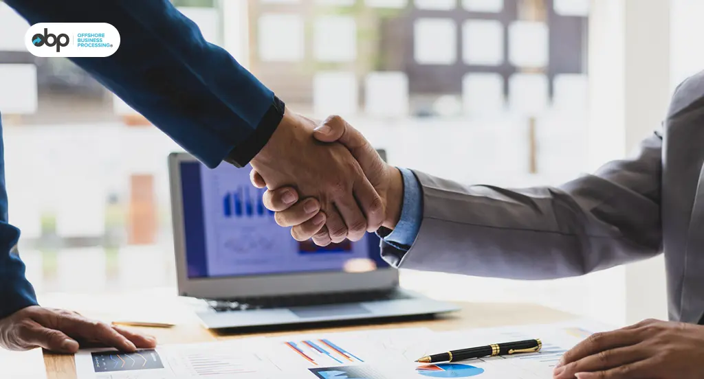 Business handshake showing trusted offshore partnership for freight forwarders